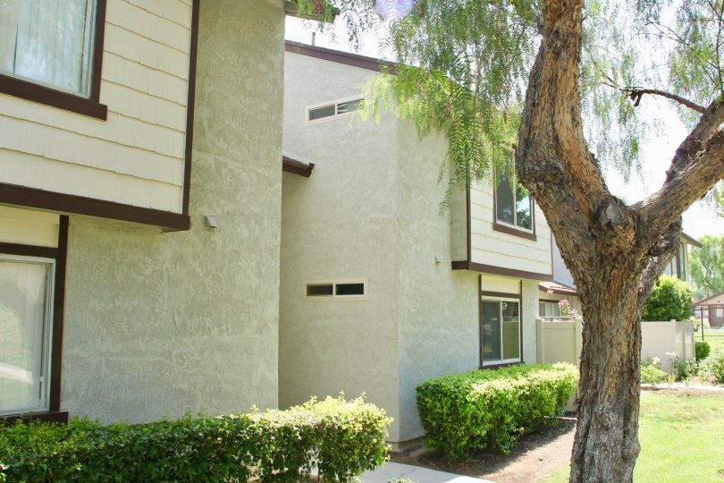 Brown trim sits on beige siding on the second floor of a building in the Laurelwood community.
