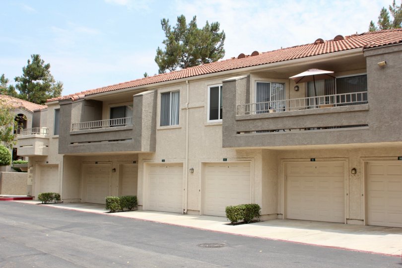 Single-family townhomes with attach garage and private balconies.