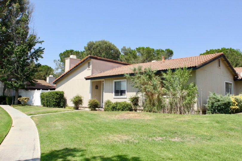 Village Grove Cluster and her cute bungalows with well mowed lawns, Corona, California