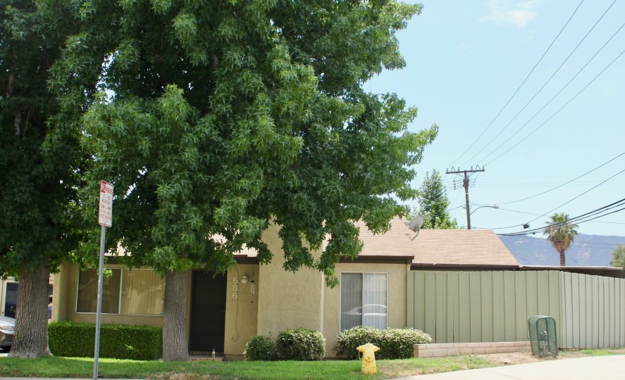 a sunny day in the Parkview Villas with small city