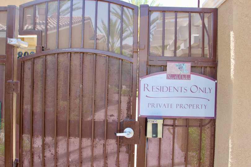 Brown gate with "Residents Only, Private Property" to the North Oaks section of Murrieta, California