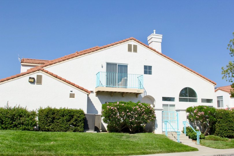 Rancho Del Mar temecula California triangle shaped house with nice chimney, blue stair structure in front
