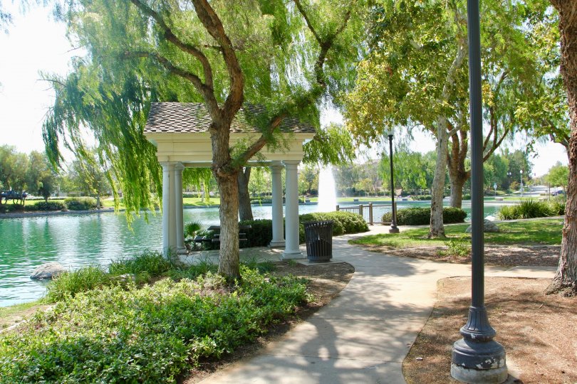 A winding walkway along a large emerald lake inside Savannah at Harveston.