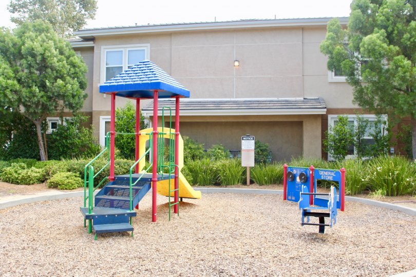 Playground for children with green grass and landscaping