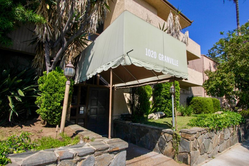 A sunny day at 1020 Granville with beautiful landscaping.