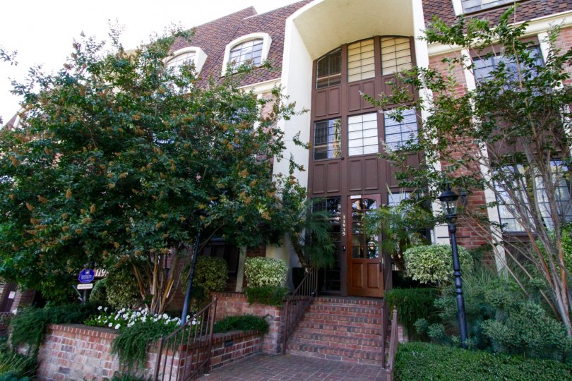 Lush and mature landscape surround the Brentwood Place building