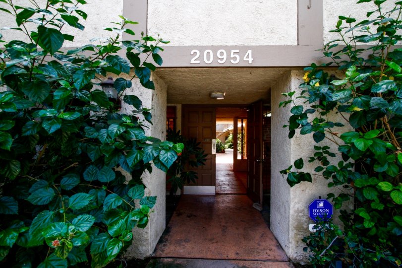 The address of 20954 Parthenia St written above the entrance