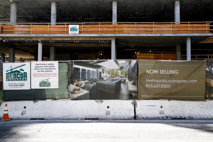 The now selling sign in front of the Metropolis in Downtown LA