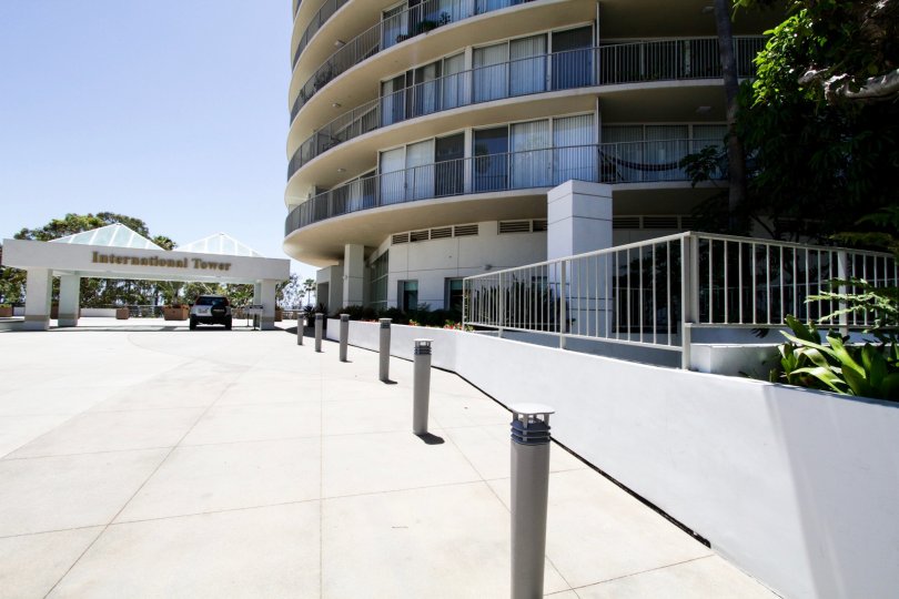 Pillars with lights create a walkway to the entrance of International Tower