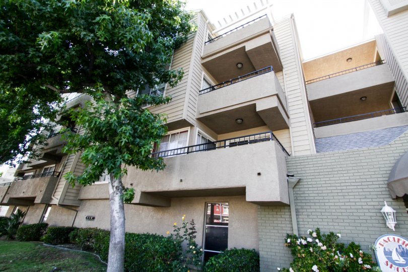 Balconies with metal rails extend from Pacific Shores