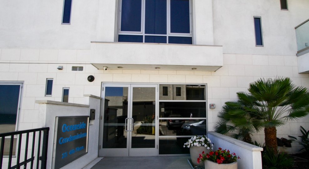 Glass doors lead to the lobby of The Oceanside