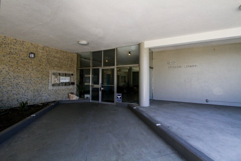 Entrance through glass doors to The Royal Palms