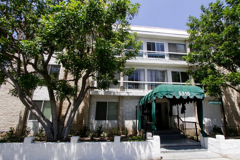 A street view of the entrance into Chateau Encino