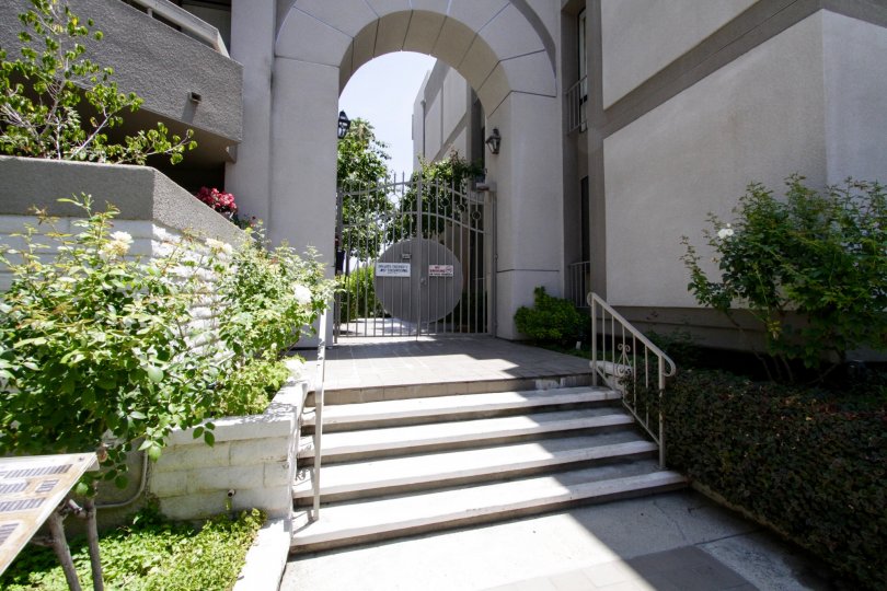 The gated entrance leading to the buildings within the Encino Spa East property