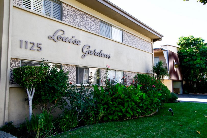 The name of Louise Gardens written on the building