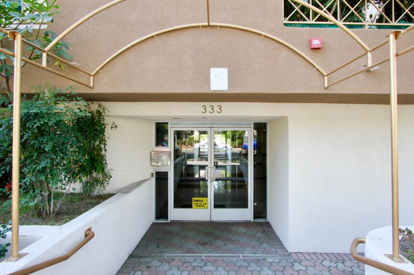 The front entrance of Westminster Village with glass doors closed