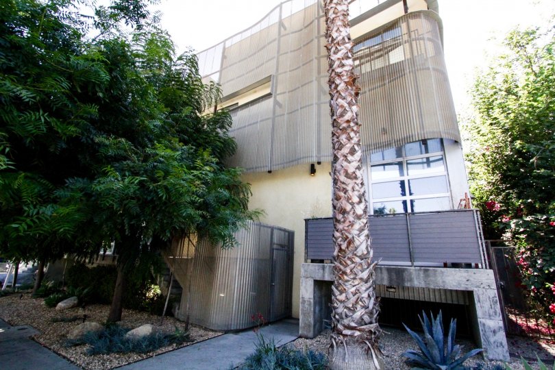 Gordon Lofts is a square stucco building wrapped by free flowing metal accents