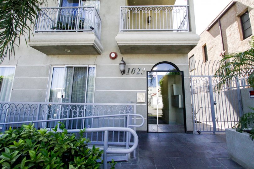 A Glass door leads the front entrance of Hollywood Gate Homes