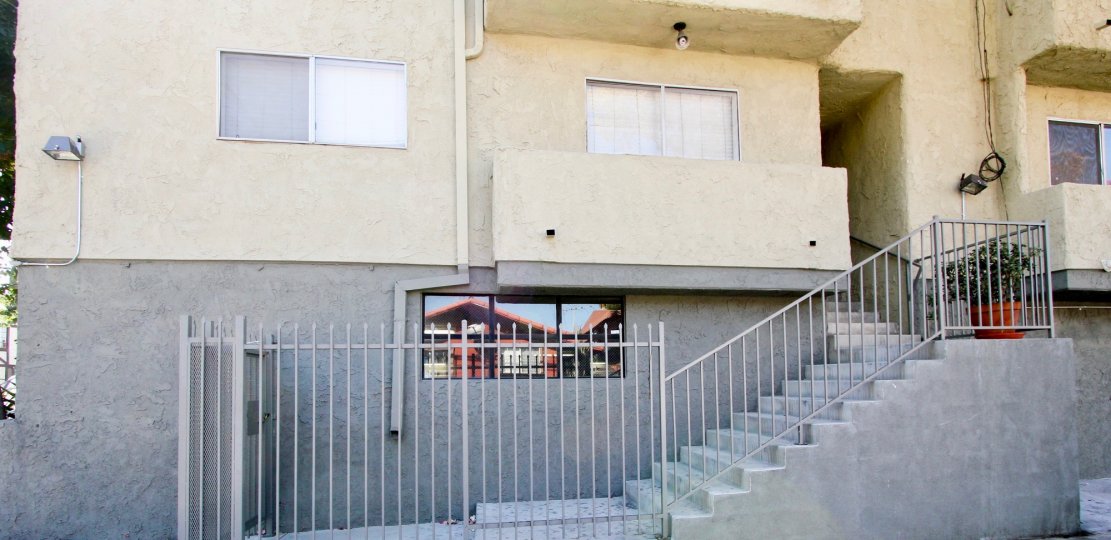The gray and yellow color of the building at Orange Drive