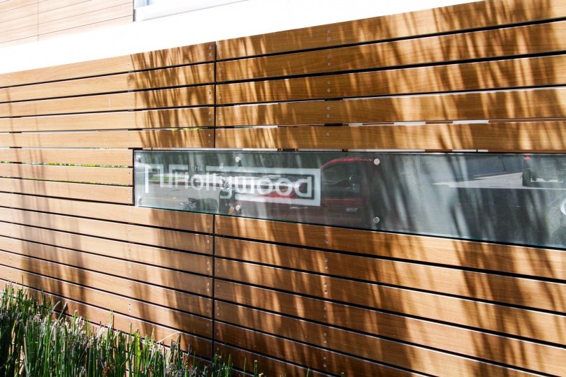 The marquee of The Hollywood made of metal covered in glass