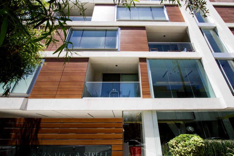 Balconies with glass rails stacked back and forth up The Hollywood building