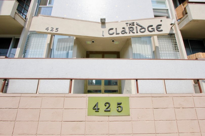 compound gate having letters 425 in front of the building in The Claridge