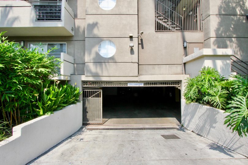The Cleo front side with open gate and plants around