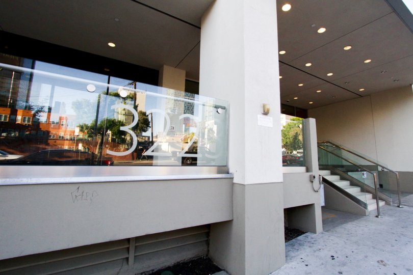 Address numbers for The Summit on Sixth are affixed to a glass balcony on the ground floor