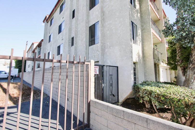 The gate into Bixby Elm Condominiums