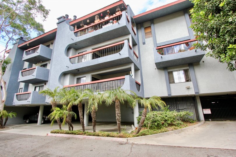 Balconies for apartments to one side of the secure entrance for an apartment building in Loma Linda, Long Beach, California.