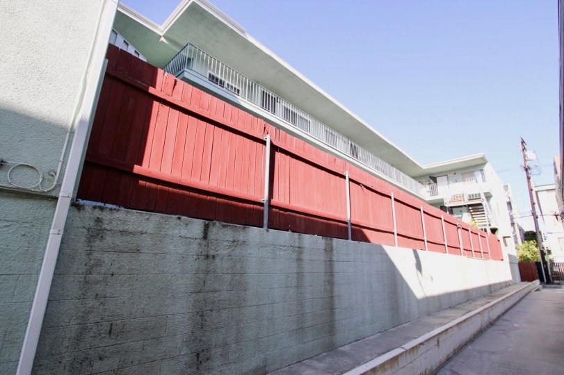 The red fence around Royal Elm for privacy