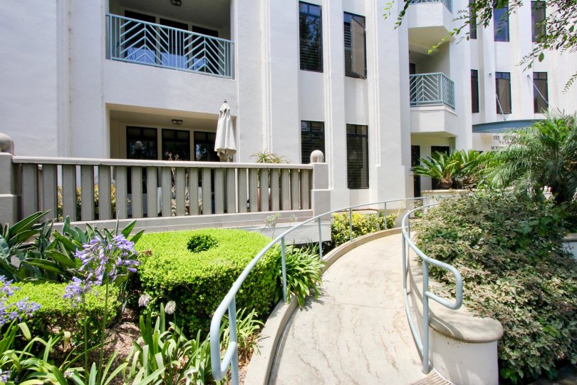 The Metro apartments with a wheelchair ramp and trees