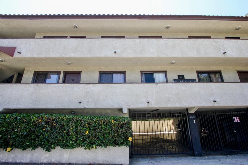 a brown building in 11574 Ohio with plants at the front