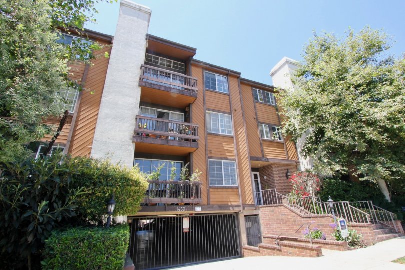 Tall modern architecture and beautiful landscaping adorns this 3 level condo with an underneath parking garage