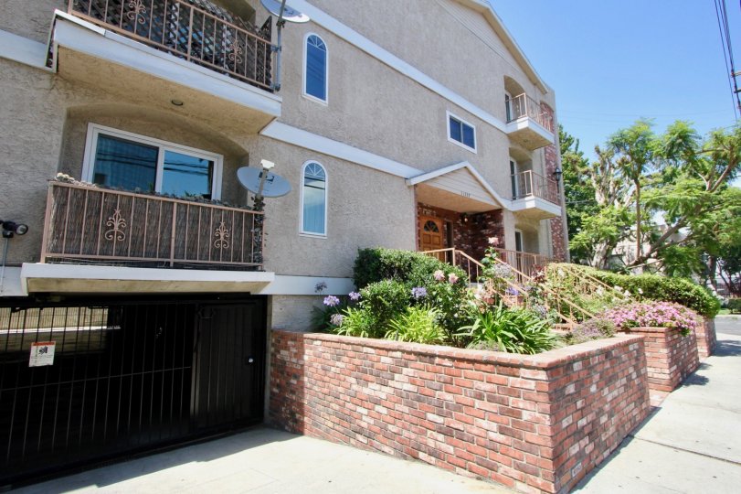 Landscaped balcony, landscaping and gated parking garage at Colonial Regency in West LA