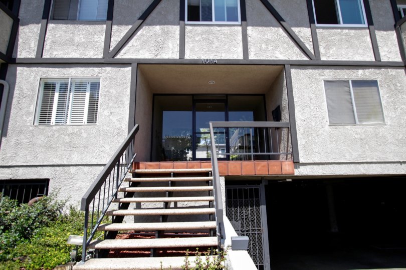 The stairwell leading up to the entrance of Corinth Condominiums