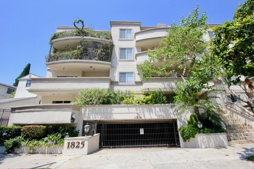 The well lit, verdure filled balconies and garage at Century Glen Townhomes.