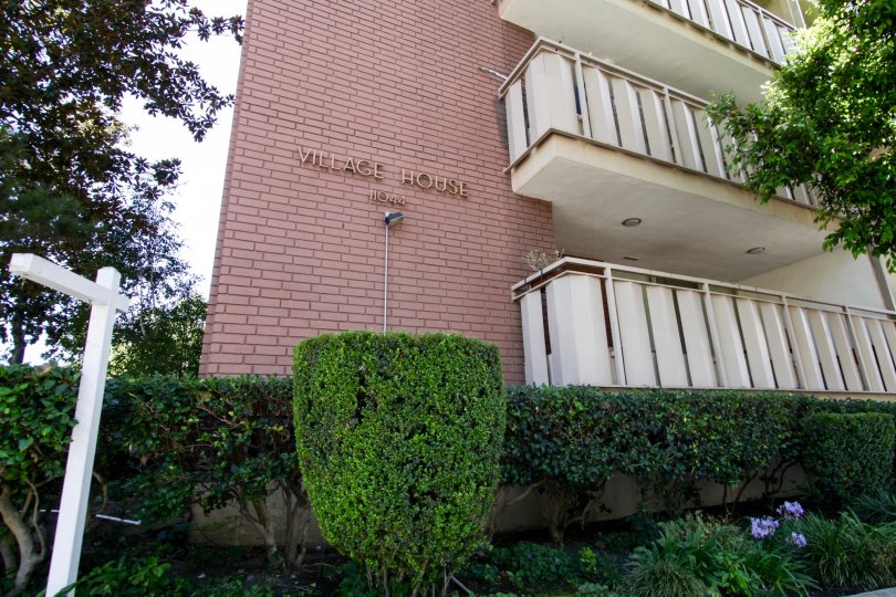 The name of the Village House on the side of the building