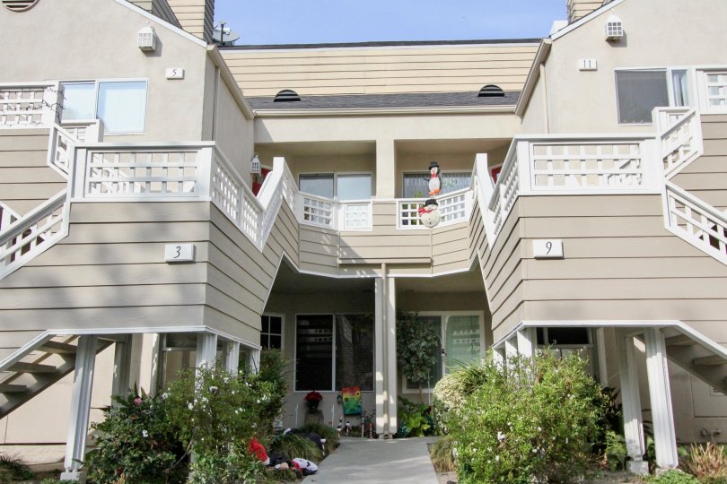 Winter decorations are on display between two units in Glenwood Village.