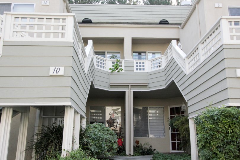 THE 12, 6, 10 FLATS IN THE GLENWOOD VILLAGE WITH THE PLANTS, TREES, BALCONIS