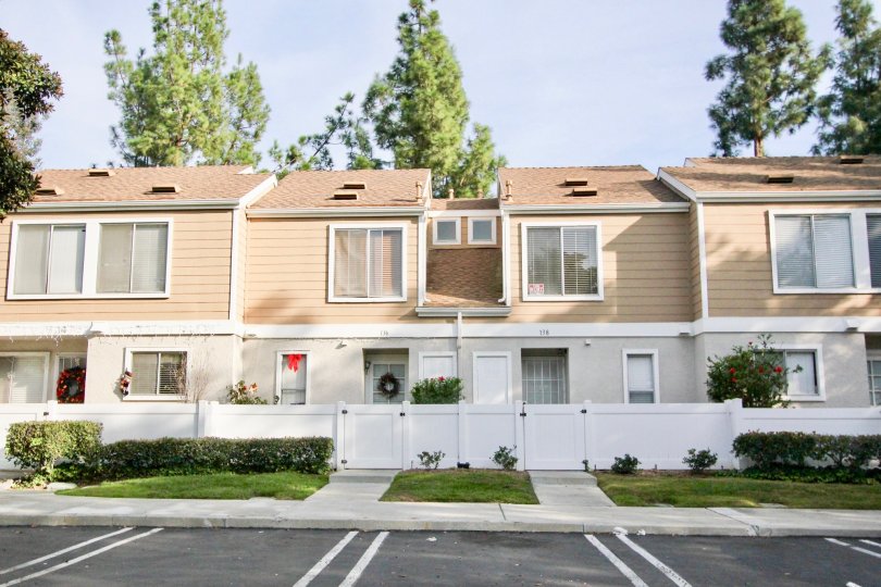 Some apartments near the road side in the Morningside with some lawn and shrubs also.