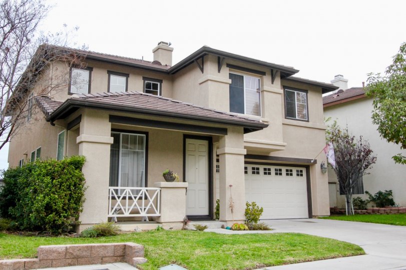 THE HOUSE IN THE CAMBRIA WITH THE LAWN, PLANTS, TREES