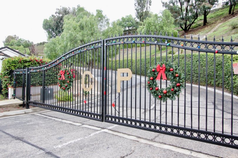 Decorated front entrance gate in front of the compound in Crown Pointe