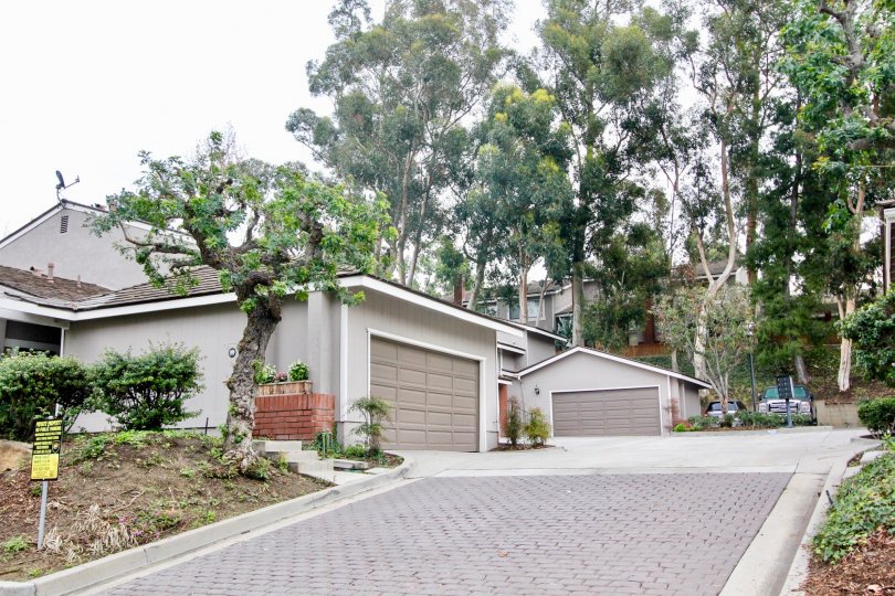 The Parkview Townhomes in the Anaheim Hills with a beautiful house and trees