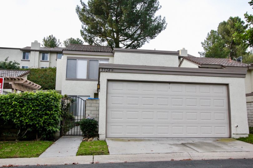 THIS SHOWS THE FRONT VIEW WITH SHED, PLANTS TREES, WHICH IS IN THE COMMUNITY OF RANCHO YORBA