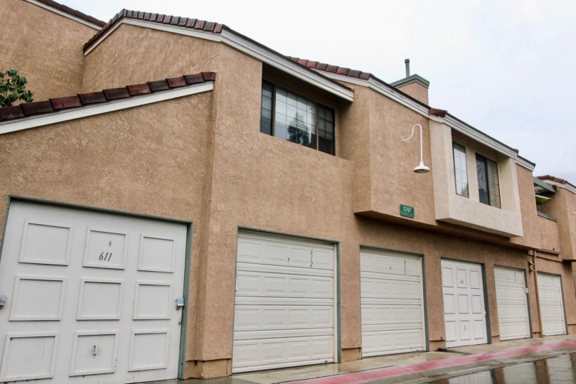 Simple brown building with white garages in Evergreen Village, Anaheim CA