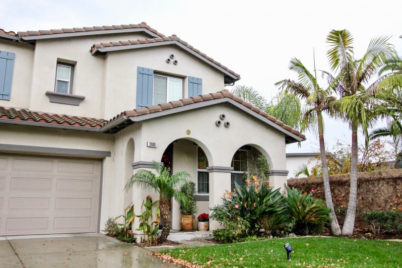 A wet day in the Rio Vista Walk with house and landscaping