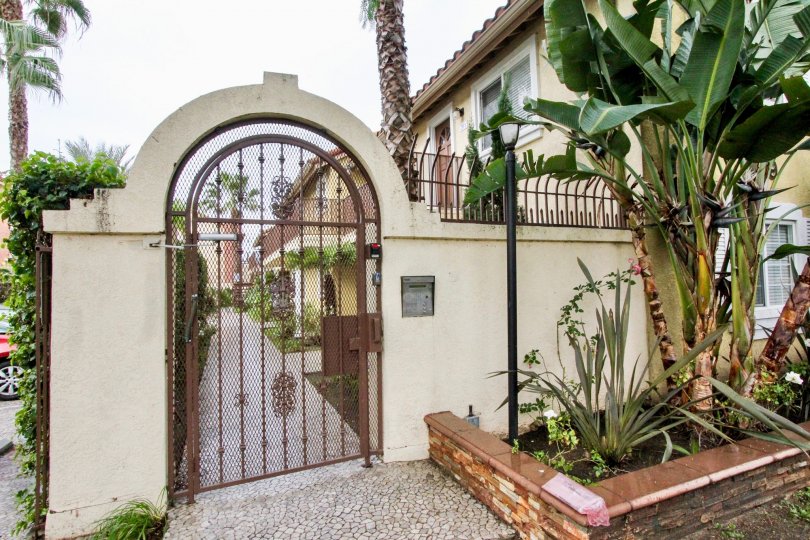 THE ENTRANCE OF THE HOUSE WITH LOT OF PLANTS, TREES SHOWN IN ANAHEIM CITY