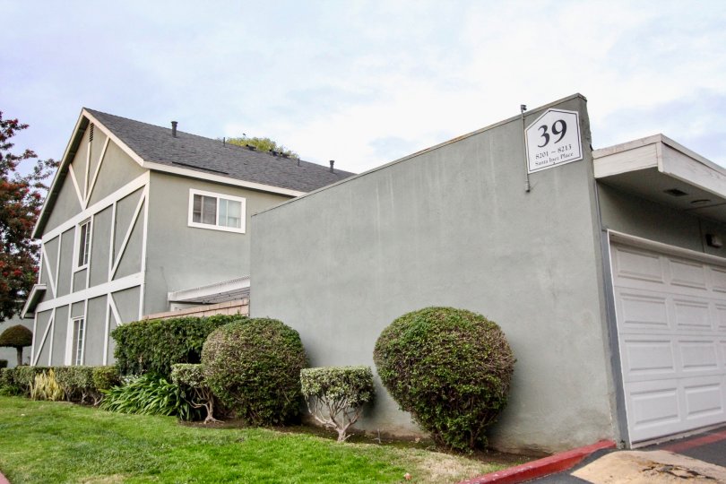 a pleasant day in the monticello town homes with a building that has parking door closed and garden around