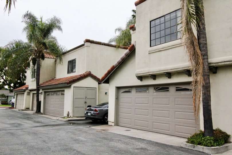 In the Palm Villas, there are some buildings and a black color car.